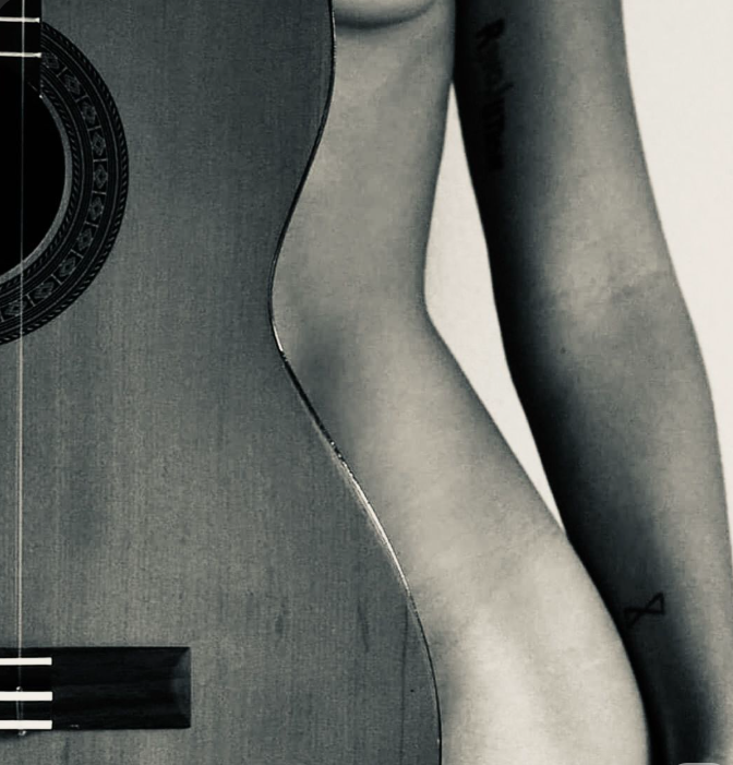 Using a guitar to create unique nude poses
